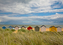 Multi Colored Huts At Beach On Sunny Day