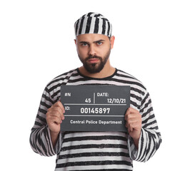 Wall Mural - Prisoner in special uniform with mugshot letter board  on white background