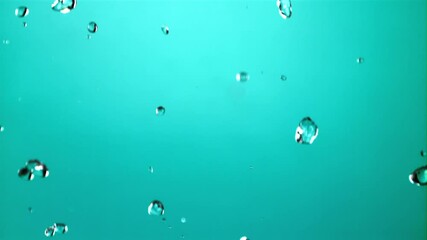 Poster - Water droplets fall down. On a blue background. Filmed is slow motion 1000 fps. High quality FullHD footage