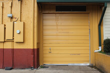 Garage Door On Warehouse And Regular Door