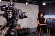 © Johnér - Female news anchor reporting news in studio
