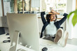 © Westend61 - Businesswoman with eyes closed relaxing at office