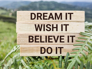 Wall Mural - Motivational and inspirational quote of dream it wish it live it text background. Stock photo.