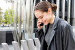 © Westend61 - Female entrepreneur smiling while talking on mobile phone