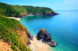 Lantic Bay Cornwall England beautiful UK secluded beach with blue turquoise sea and yachts
