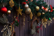 A Beautifully Decorated Wooden Fence With Christmas Decorations. Christmas Mood. Happy New Year And Merry Christmas!
