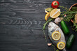 fish on wooden board ingredients lemon fresh food sea food