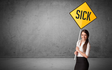 Young business person holding road sign