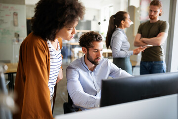 Software engineers working on project and programming in company