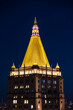 The New York Life building roof shines against the night with it's gold-leaf dipped terrocotta tiles