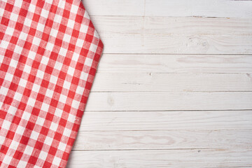 Wall Mural - Red checkered tablecloth wooden background texture kitchen decoration