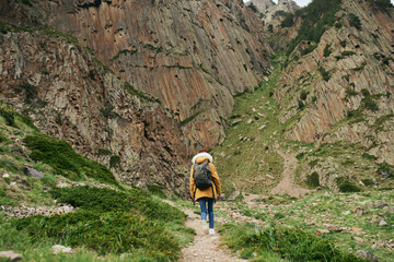 woman hiker with backpack mountains travel adventure freedom