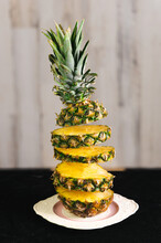 Fresh Whole Pineapple Sliced Magically With Pieces Stacked Vertically. 