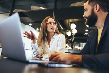 businesspeople having a discussion in an office