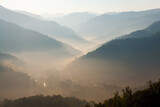 Fototapeta Natura - Mountain landscape in winter. forest and fog. Cloudy day.