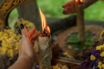 Altar of wicca, candle, magic books, tarot cards and other witch stuff. Mystic background with ritual esoteric objects, occult, fortune telling and Halloween concept