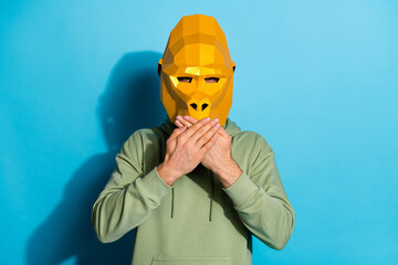 Wall Mural - Photo of upset shocked guy dressed wild animal mask arms close mouth isolated blue color background