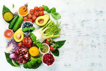 Wall Mural - Diet food concept: fresh vegetables and fruits on white wooden background. Free space for your text.