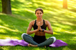 © Prostock-studio - Slim black woman practicing yoga at park