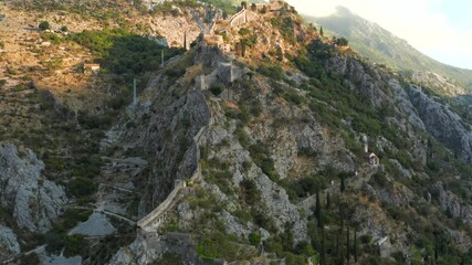 Wall Mural - Sunset view at the top of St John (San Giovanni) Fortress and Castle, Old Town, Kotor, Bay of Kotor, Montenegro.