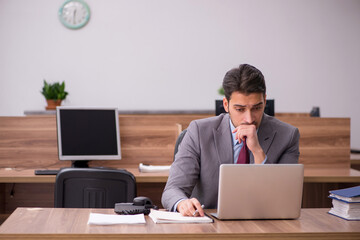 Young businessman employee working in the office