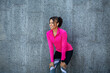 © Prostock-studio - Happy black girl jogger resting while training at park