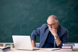 © Elnur - Old male teacher in tele-education concept