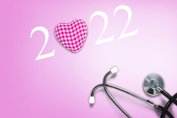 Wall Mural - 2022 with Red heart with a stethoscope, heart health, health insurance concept,