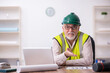 © Elnur - Old male architect working in the office