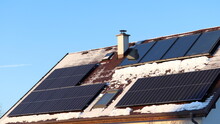 Photovoltaic panels vs. thermal solar panels. Energy production on the roof of the house. Self-cleaning effect of solar systems in winter.