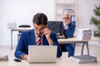© Elnur - Two male colleagues working in the office