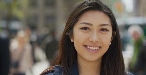 Wall Mural - Young Asian woman in city face portrait