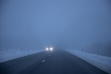 Foggy Road In The Evening. Winter Asphalt Road Blurred. Blurred Photo
