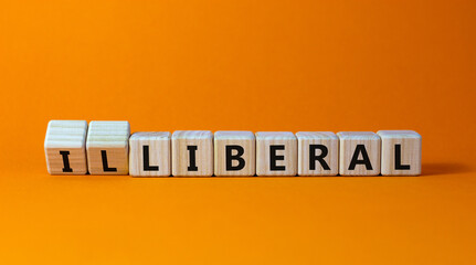 Wall Mural - Illiberal or liberal symbol. Turned wooden cubes and changed the word illiberal to liberal. Beautiful orange background. Business, political and illiberal or liberal concept. Copy space.