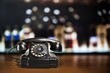 Retro rotary telephone on table front background. Vintage old style
