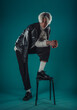 © qunica.com - Male beauty concept. Portrait of fashionable young man with stylish haircut wearing trendy glasses and sweater, posing over gray background. Perfect hair & skin. Hipster style. Copy-space. Studio shot
