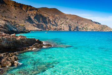 Wall Mural - Turquoise clear water of Octopus bay and rocks, Crete, Greece