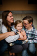 © Cavan Images - Family Hugging & Smiling for Camera in San Diego