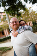 © Cavan Images - Dad with Son on Piggyback in San Diego