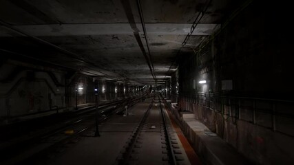 Wall Mural - Front cabin view of driverless metro train moving through underground tunnel. Automated advanced transportation system, subway in Beijing, China