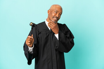 Sticker - Judge senior man isolated on blue background looking to the side and smiling