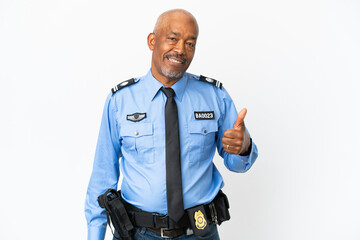 Wall Mural - Young police man isolated on white background giving a thumbs up gesture