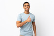 © luismolinero - African American man over isolated white background giving a thumbs up gesture