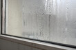 Typical winter window with a lot of condensated water. Window condensation.