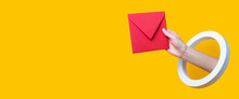 Female Hand Holding A Red Envelope In A Round Hole On A Yellow Background. Banner.