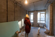 © Angelov - People renovating the house, woman in apartment renovation