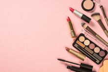 Make Up Products At Pink Background. Eye Shadow, Powder, Cream, Lipstick And More For Professional Make Up. Top View Image With Copy Space.