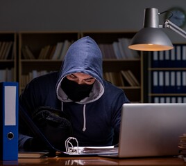 hacker stealing personal data from home computer