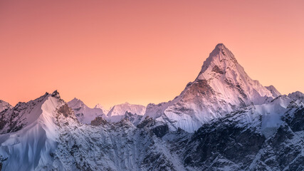 panoramic view to summit ama dablam and snow peaks with beautiful light after sunset in nepal