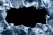 A frame made of broken pieces of ice. Ice chunks with a hole in the middle isolated on a black background.